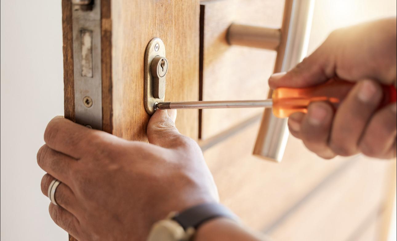 Emergency locksmith attending a lockout